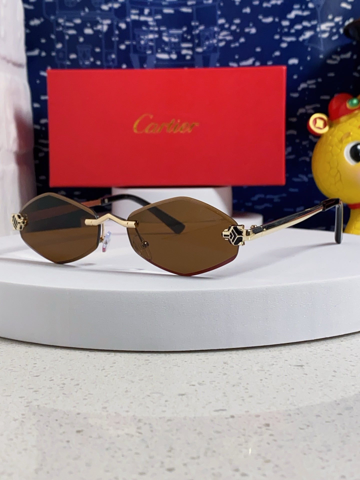 PANTHÈRE RIMLESS RHOMBUS FRAME SUNGLASSES CT0443S IN METAL